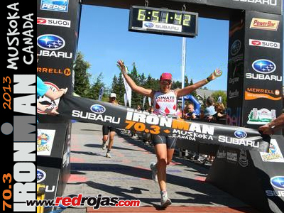 Andrea crossing the finish line - Ironman 70.3 - Muskoka, ON, Canada - September 8, 2013